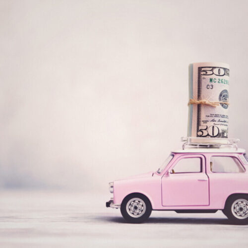 Cute Pink Vintage Car with Money Roll on Roof Rack